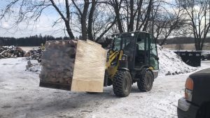 Loader With Racked Firewood