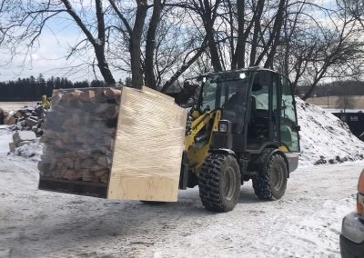 Loader With Racked Firewood